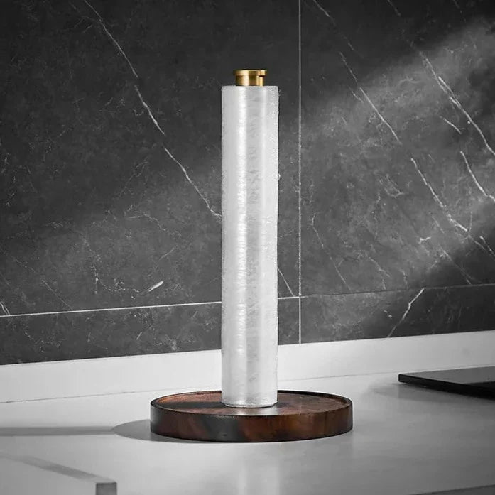 Crafted walnut paper towel holder displayed on a kitchen countertop