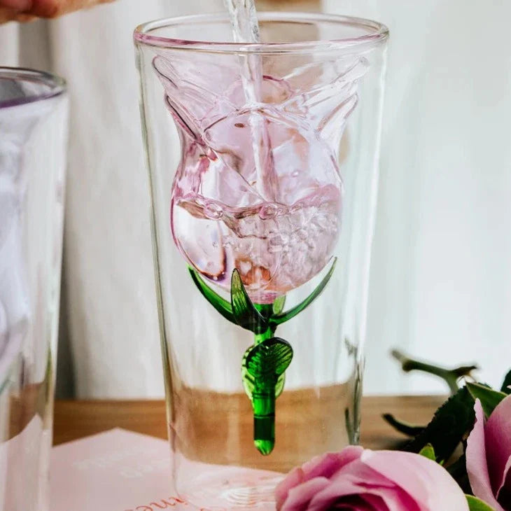 Handcrafted rose glass with intricate blossom details on a dining table