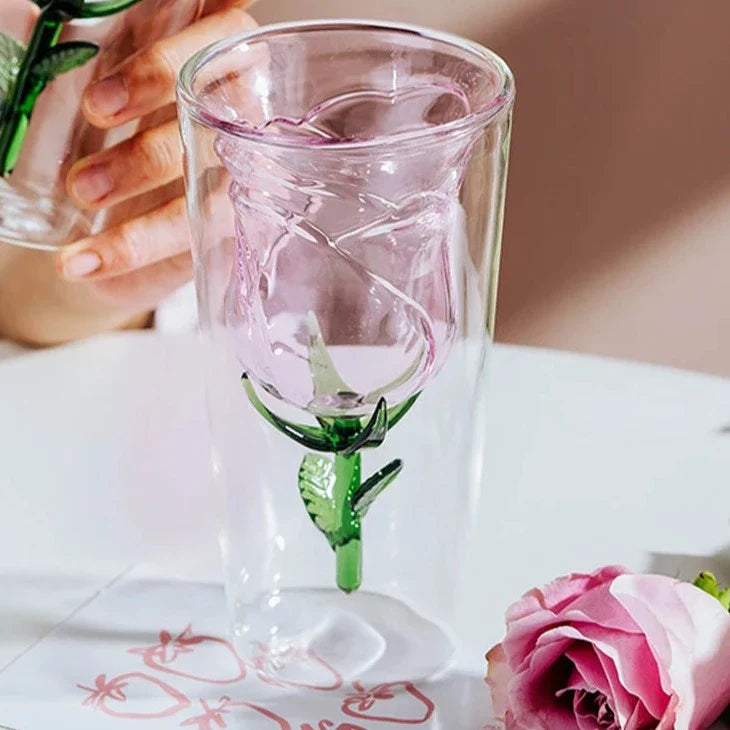 Handcrafted rose glass with intricate blossom details on a dining table