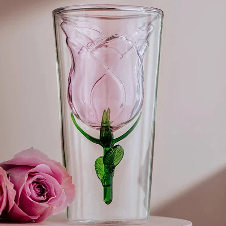 Handcrafted rose glass with intricate blossom details on a dining table