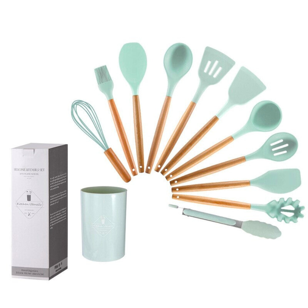 Non-stick kitchenware set displayed on a modern kitchen countertop.