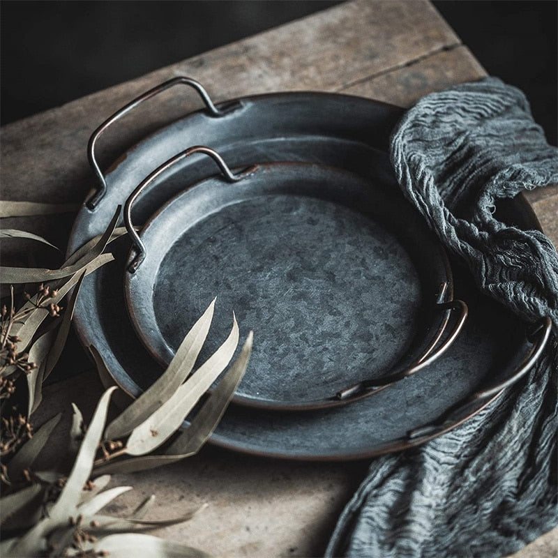Vintage-style serving tray with a rustic finish on a dining table 1