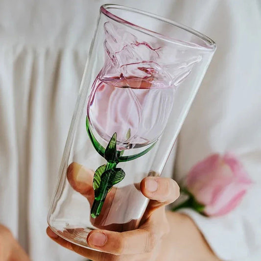 Handcrafted rose glass with intricate blossom details on a dining table