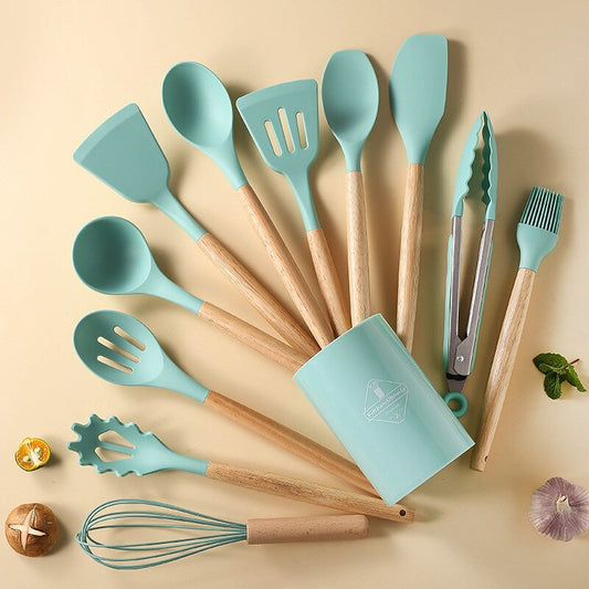 Non-stick kitchenware set displayed on a modern kitchen countertop.
