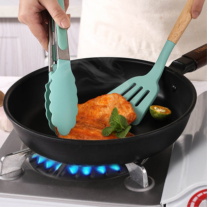 Non-stick kitchenware set displayed on a modern kitchen countertop.
